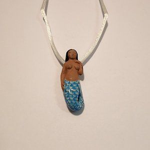 Black-haired dark skin Mermaid Clay Pendant on white cord